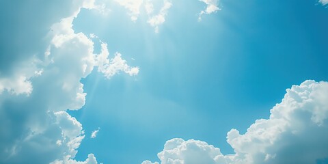 Clear blue sky with scattered white clouds, suitable for layout backgrounds on bright days