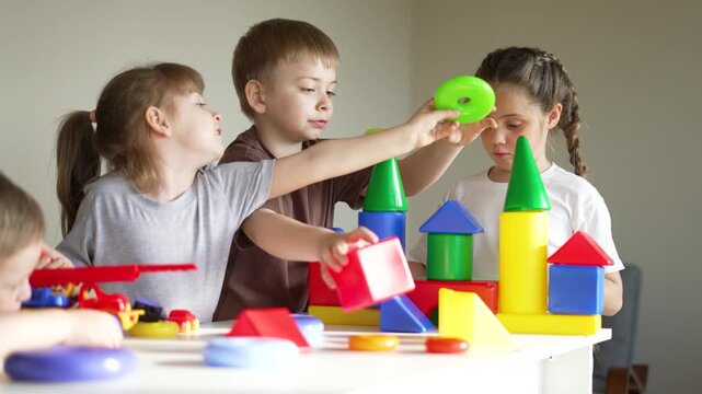 Children play with colorful blocks and toy on table showing child creativity and kid cooperation building block for preschool education and teamwork learning through playful exploration and sharing