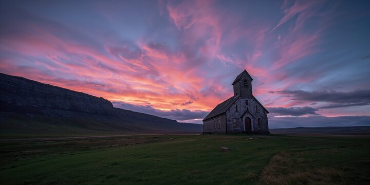 Sunset at the Church of Hellnar in Iceland, capturing a serene coastal landscape