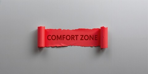 Torn red paper with written message about comfort zone on gray backdrop, serving as a text overlay background