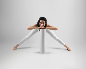 Template of white floor mat for yoga, rolled up, posing smiling trainer in leggings, top, isolated on background, front view.
