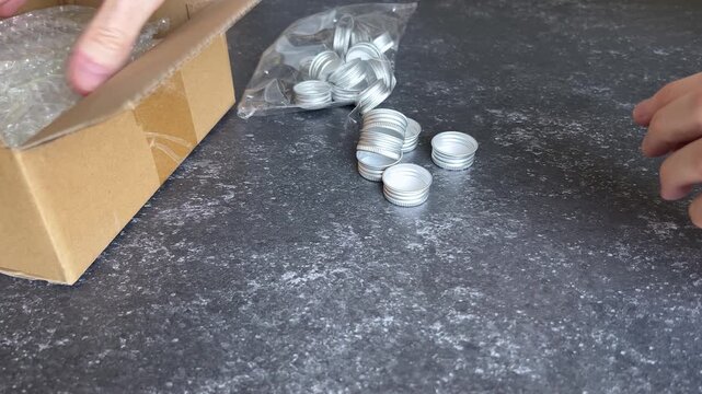 Small, new, empty glass jars, removed from their packaging. 10 ml mini clear bottle with aluminum screw caps, for small items and liquids such as pills, beads, spices, essential oils and more