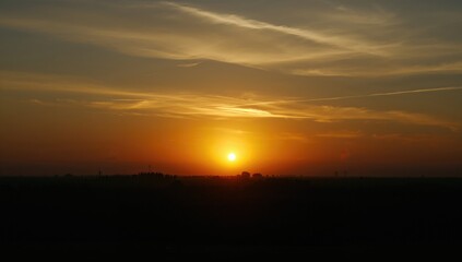 Obraz premium Sunrise with vibrant colors illuminating the sky, symbolizing hope and renewal, World Environment Day