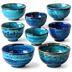 Nine blue textured ceramic bowls arranged artfully