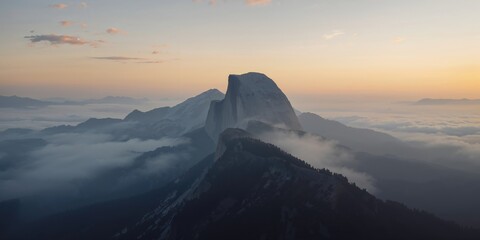 Mountain landscape shrouded in fog serving as a natural backdrop for landscape photography