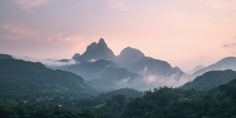 Mountain peaks shrouded in morning fog, atmospheric conditions and natural landscape features