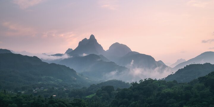 Mountain peaks shrouded in morning fog, atmospheric conditions and natural landscape features - Powered by Adobe