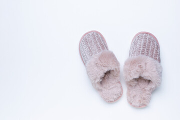 Cozy Pink Fuzzy Slippers on Minimalist White Background Perfect for Relaxation and Comfort