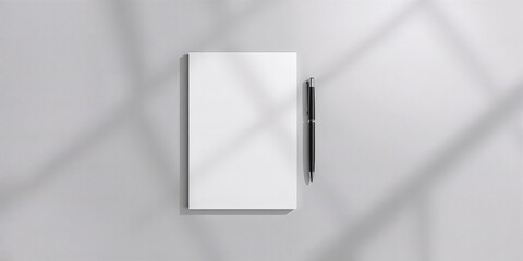 Note papers and pen on a gray background used for writing or note-taking, workspace organization
