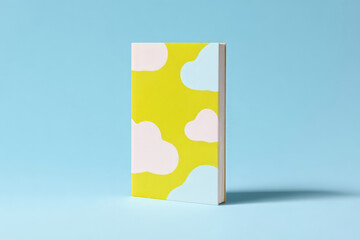 Colorful hardcover book with cloud patterns on blue background