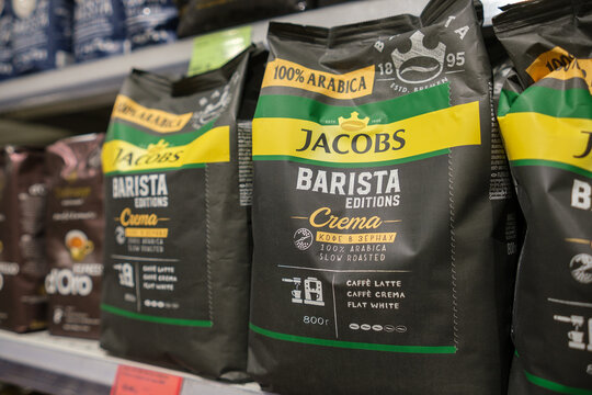December 8, 2025, Vitebsk, Belarus. Coffee Bags for Sale in a Grocery Store Aisle During the Morning Hours Featuring Dark Packaging With Green and Yellow Labels