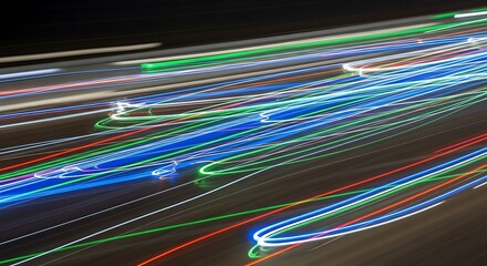 Abstract light trails vibrant streaks of color against a dark backdrop