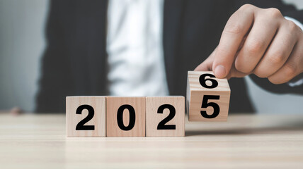 Changing year from 2022 to 2025 with wooden blocks