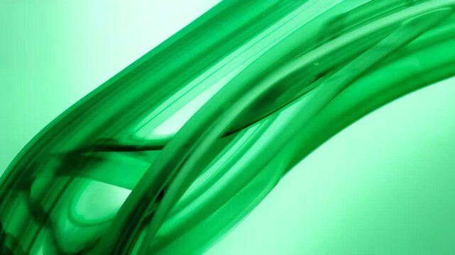 Abstract green flowing shapes creating smooth undulating paths with glossy texture illuminated by soft lighting against a pale background with visual continuity from beginning to end