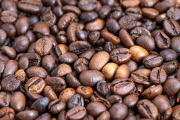 Closeup macro coffee bean textures highlighting micro cracks and oil droplets, surface sheen and tactile detail for sensory marketing and high-detail product photography