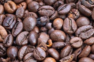 Detailed imagery highlighting glossy surface and aromatic features of beans, Vivid closeup captures lustrous surface and fragrant qualities of roasted coffee beans