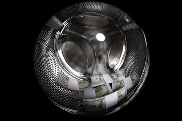 Many dollar banknotes in washing machine, closeup. Wide angle lens