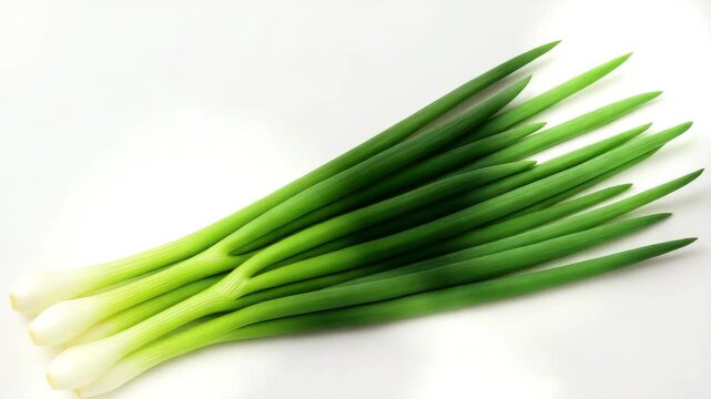 Fresh green onions on white background overhead flat lay for cooking and food photography