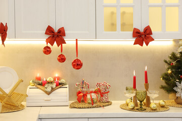 Christmas decor and sweets on countertop in kitchen. Interior design
