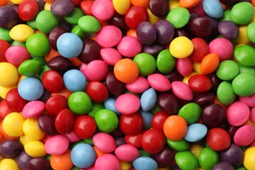 Many delicious colorful candies as background, closeup