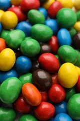 Many delicious colorful candies as background, closeup