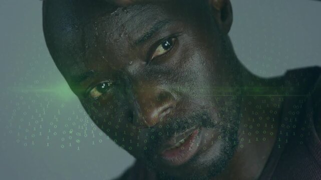 Mature man raising hand as projection intensifying, reading tech grid across face with green flare