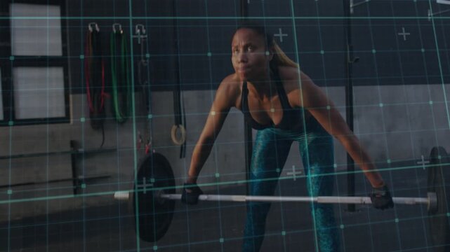 Woman bracing and breathing, pulling then pressing bar overhead while grid tracing path for fitness