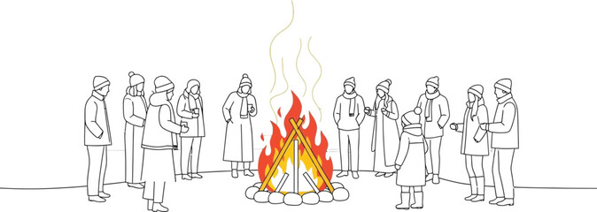 Group of bundled people standing around a bright bonfire outdoors during a snowy winter festival event