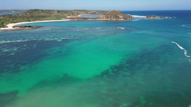 Lombok, Indonesia, Beach ocean drone aerial view landscape at Tanjung Ann beach area. Lombok is an island in West Nusa Tenggara province, Indonesia.