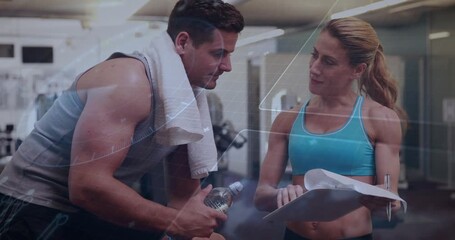 Female trainer pointing to clipboard, client leaning in, confirming fitness plan, overlay appearing