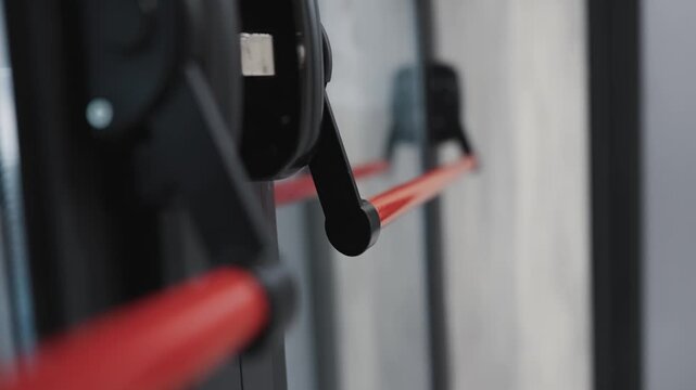 Close-up of manual emergency door latch handle with red bar detail