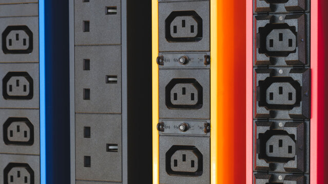 Electricity sockets IEC 60320 C13 in the server rack. Electicity sockets (Iin the server rack as technology style concept background as template, page or web banner