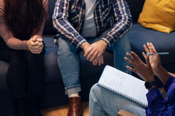 Couple having psychotherapy session with counselor
