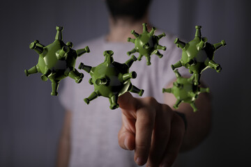 3D render illustration of a hand touching virus cells. The concept of the COVID-19 pandemic and virus spreadin