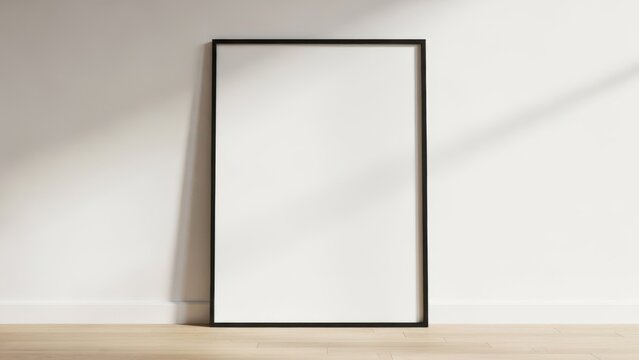 Tall rectangular blank frame leaning against a wall with sunlight shadows