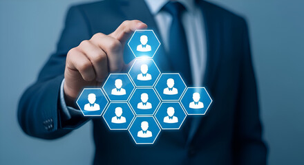 Businessman in blue suit interacting with digital hexagons icons of people on blue background, representing online networking and communication concept
