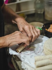 Hands of a woman making a traditional dish in México called 