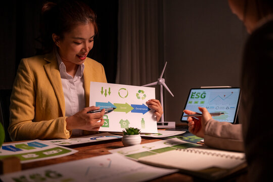 Businesswoman presenting esg environmental social governance data - Powered by Adobe