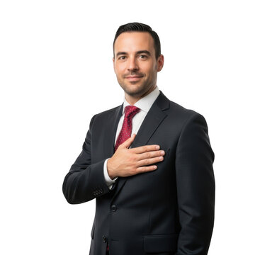 Professional businessman in a dark suit and red tie places his hand over his heart with a sincere expression isolated on transparent background