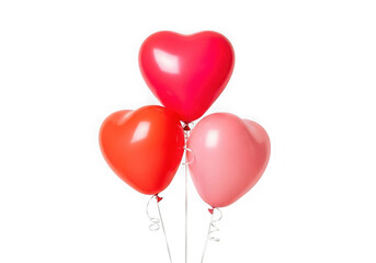 Three Heart Shaped Balloons in Red Pink and Coral Isolated on Black