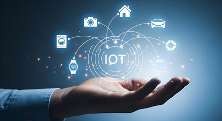 Hand holding futuristic iot interface with connected devices and glowing network in blue background