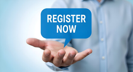 Man holding a blue speech bubble with the words register now in white text, against a blurred blue background, inviting registration or sign up