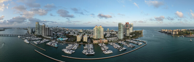 Obraz premium Panorama of Miami from above. Drone view of Miamis famous landmarks. South Pointe beach with skyscrapers. Miami city panorama. Oceanfront skyline of Miami Beach.