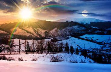 winter solstice sky over the mountains. day and night time change concept. beautiful light on snowy...