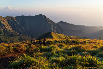 Hikers watching sunrise from Pergasingan Hill Lombok Indonesia