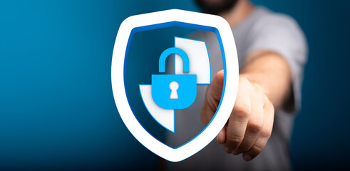 Concept image of security and protection. A shield with a padlock overlaid on a hand with copy space. This stock photo is ideal for i