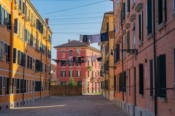 Colorful alleyway Narrow residential street Venice, Italy, colorful facades, shuttered windows, hanging laundry