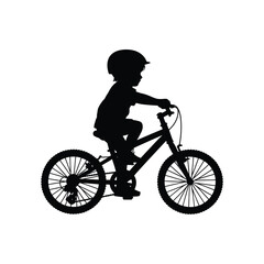 Obraz premium A silhouette of a child riding a bicycle enjoying outdoor activity