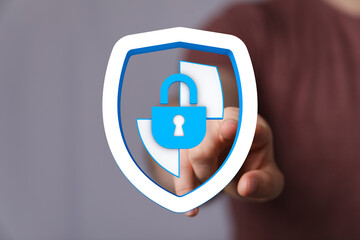 Protecting digital data, network security, and internet privacy with a padlock shield icon. This image symbolizes security, safety, a