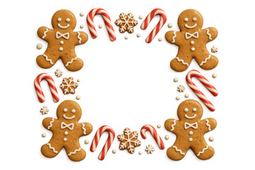 Naklejka premium Gingerbread men and candy canes forming a festive holiday frame, christmas cookies and sweets on transparent background